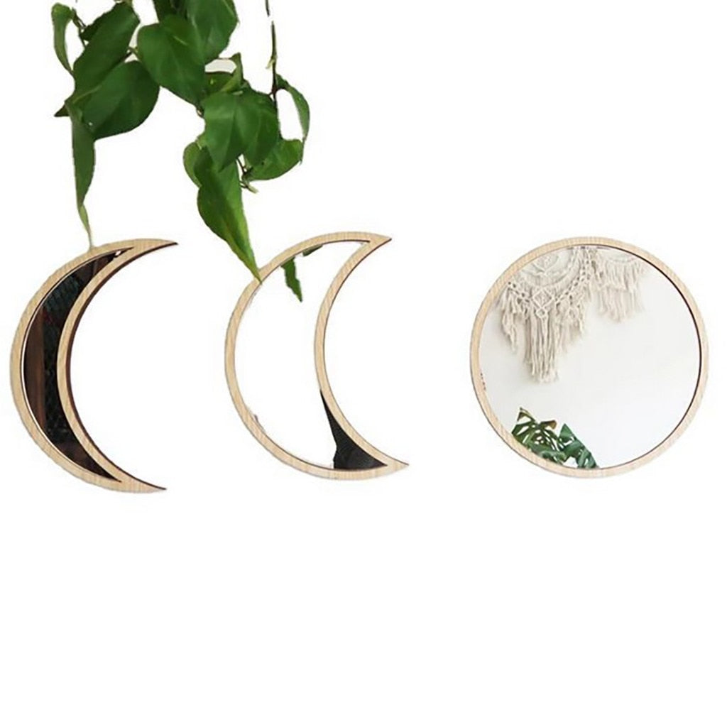 Beige three-piece moon phase wall mirror set with wooden frames featuring crescent and full moon shapes displayed on a white wall with hanging greenery and soft natural light. — for Carpe Diem Dream