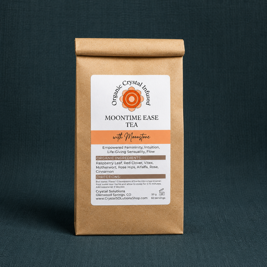 Moon Time Ease Tea – Organic Crystal-Infused Tea with Moonstone, 50 g loose-leaf herbal tea package on a textured  linen background with cool diffused daylight and soft contact shadow. — for Carpe Diem Dream