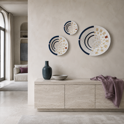 Moonrise Wall Basket handwoven decorative wall basket with natural, navy, and golden woven pattern styled in a serene everyday living space with cool-toned décor. — for Carpe Diem Dream