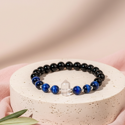 Negativity Filter gemstone bracelet displayed upright on soft blush background with natural shadow. — for Carpe Diem Dream