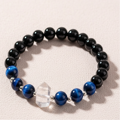 Negativity Filter gemstone bracelet displayed upright on soft blush background with natural shadow. — for Carpe Diem Dream