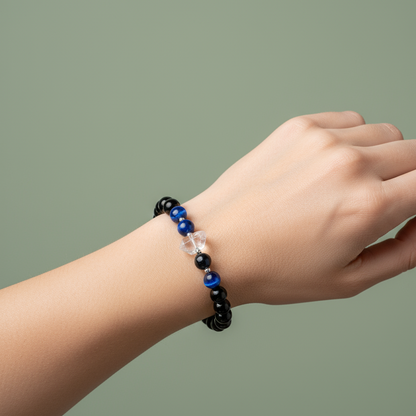 Negativity Filter gemstone bracelet worn on wrist against soft green backdrop with natural lighting. — for Carpe Diem Dream