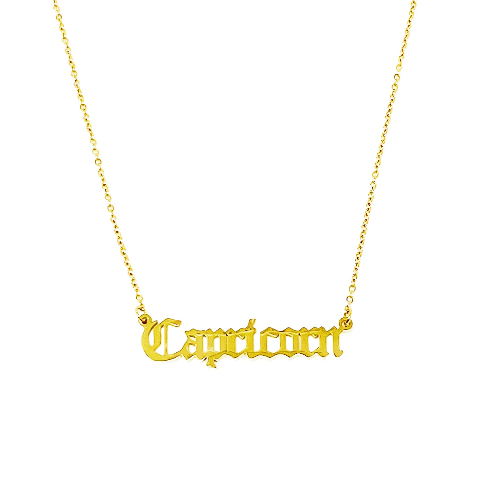 Gold Old English Zodiac Capricorn Necklace with astrology lettering on white background for Carpe Diem Dream