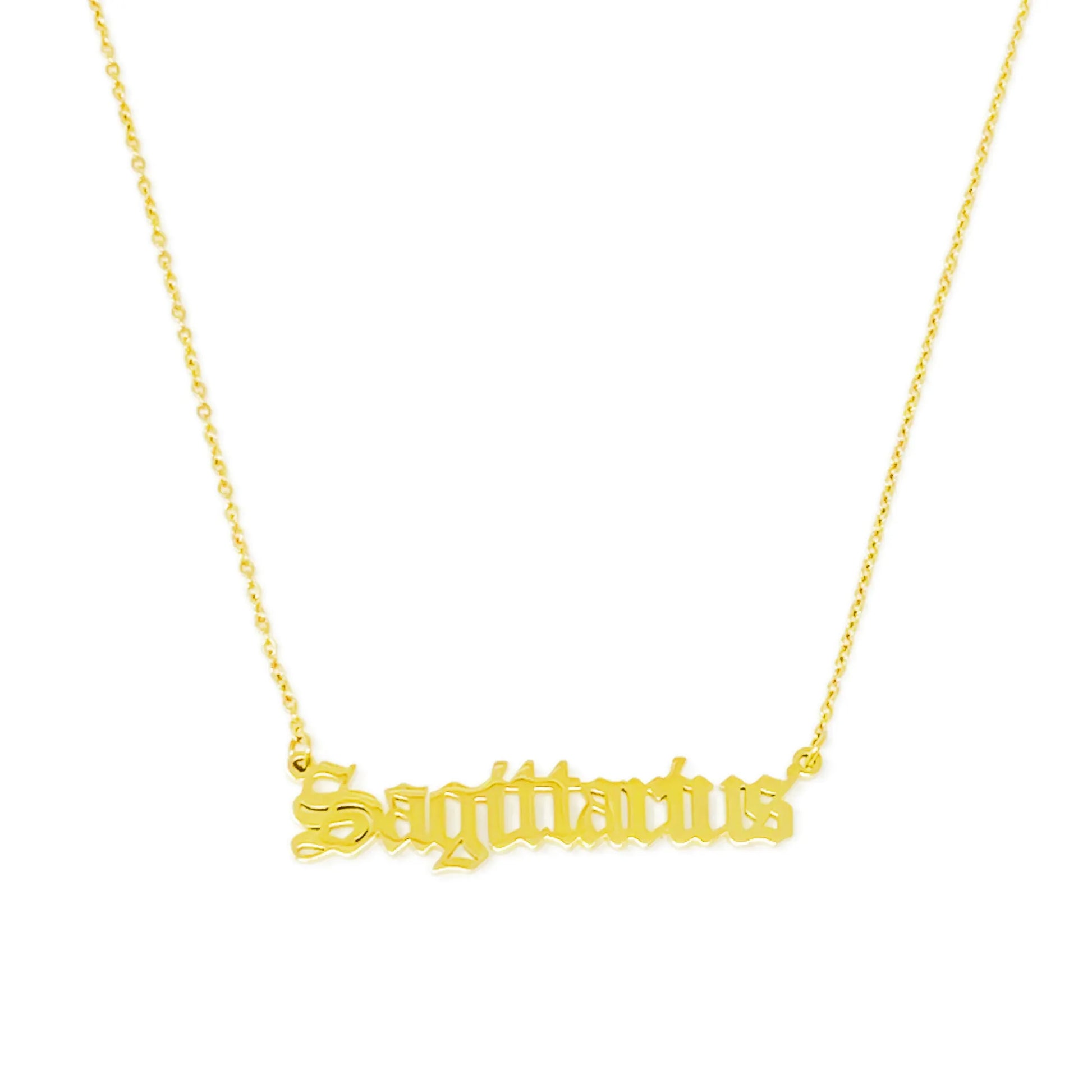 Gold Old English Zodiac Sagittarius Necklace with astrology lettering on white background for Carpe Diem Dream