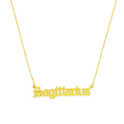 Gold Old English Zodiac Sagittarius Necklace with astrology lettering on white background for Carpe Diem Dream