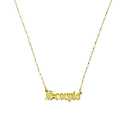 Gold Old English Zodiac Scorpio Necklace with astrology lettering on white background for Carpe Diem Dream