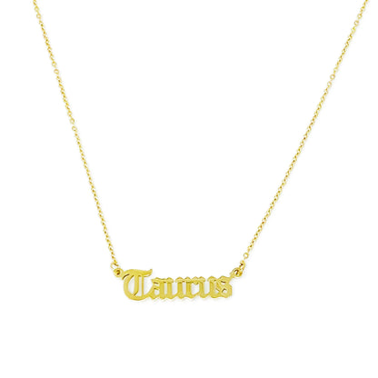 Gold Old English Zodiac Taurus Necklace with astrology lettering on white background for Carpe Diem Dream