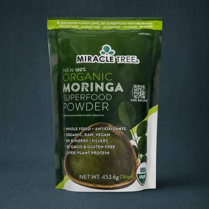 Organic Moringa Superfood Powder 16oz pouch displayed on a dark teal linen backdrop with crisp front label detail. — for Carpe Diem Dream