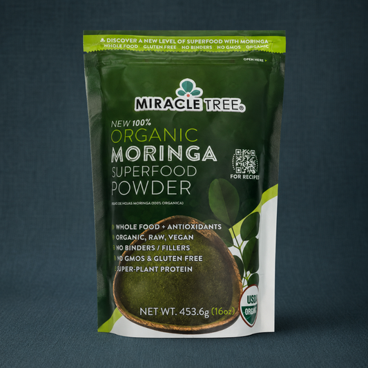 Organic Moringa Superfood Powder 16oz pouch displayed on a dark teal linen backdrop with crisp front label detail. — for Carpe Diem Dream