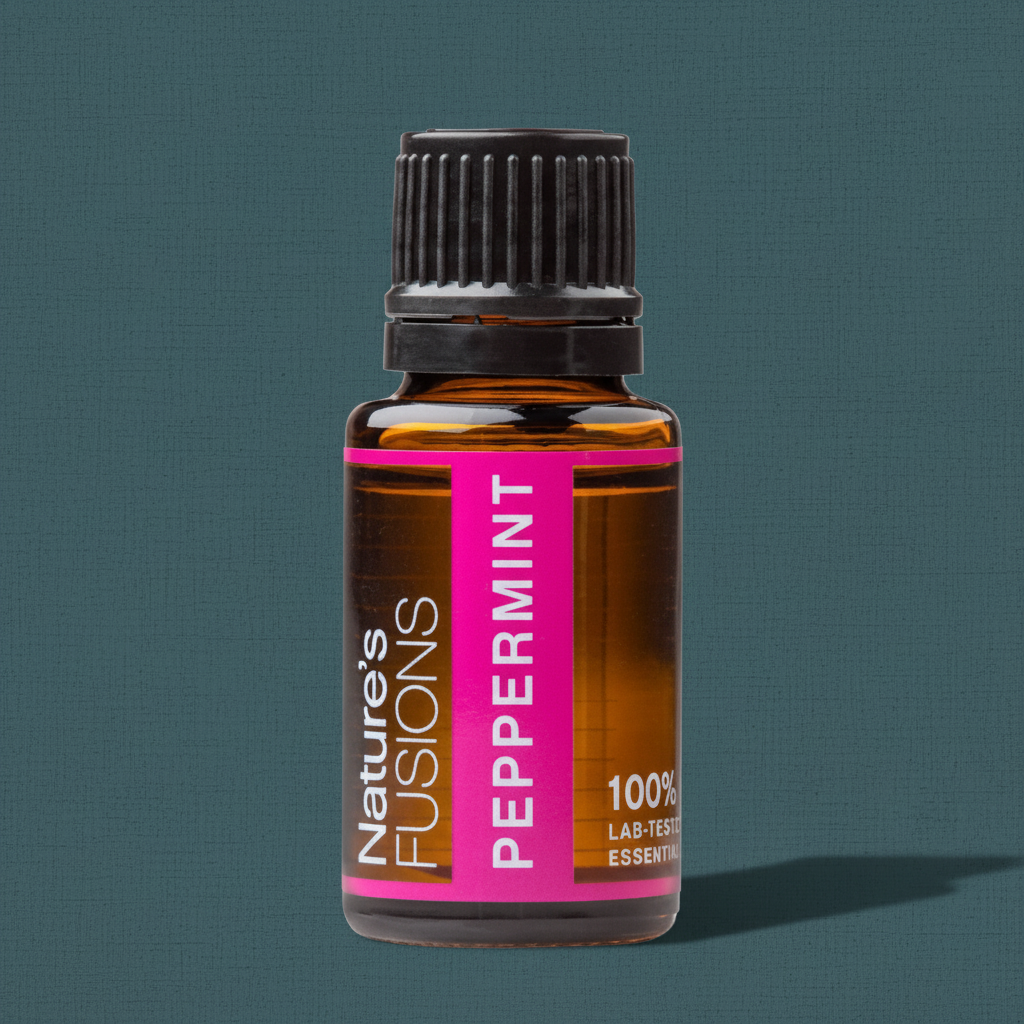 Close-up of amber glass bottle of Peppermint Essential Oil with black ribbed cap on muted teal textured background. — for Carpe Diem Dream