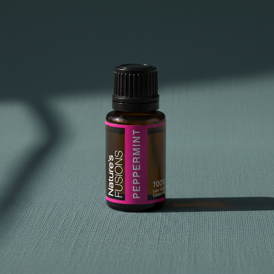 Amber glass bottle of Peppermint Essential Oil standing upright on muted teal textured background with soft directional shadow. — for Carpe Diem Dream