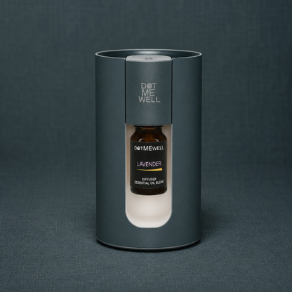 Portable waterless essential oil diffuser with visible lavender essential oil blend bottle, photographed on a textured dark teal linen studio backdrop. — for Carpe Diem Dream