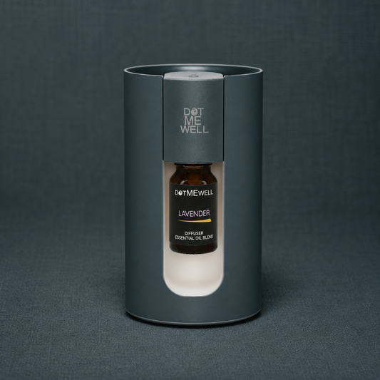 Portable waterless essential oil diffuser with visible lavender essential oil blend bottle, photographed on a textured dark teal linen studio backdrop. — for Carpe Diem Dream