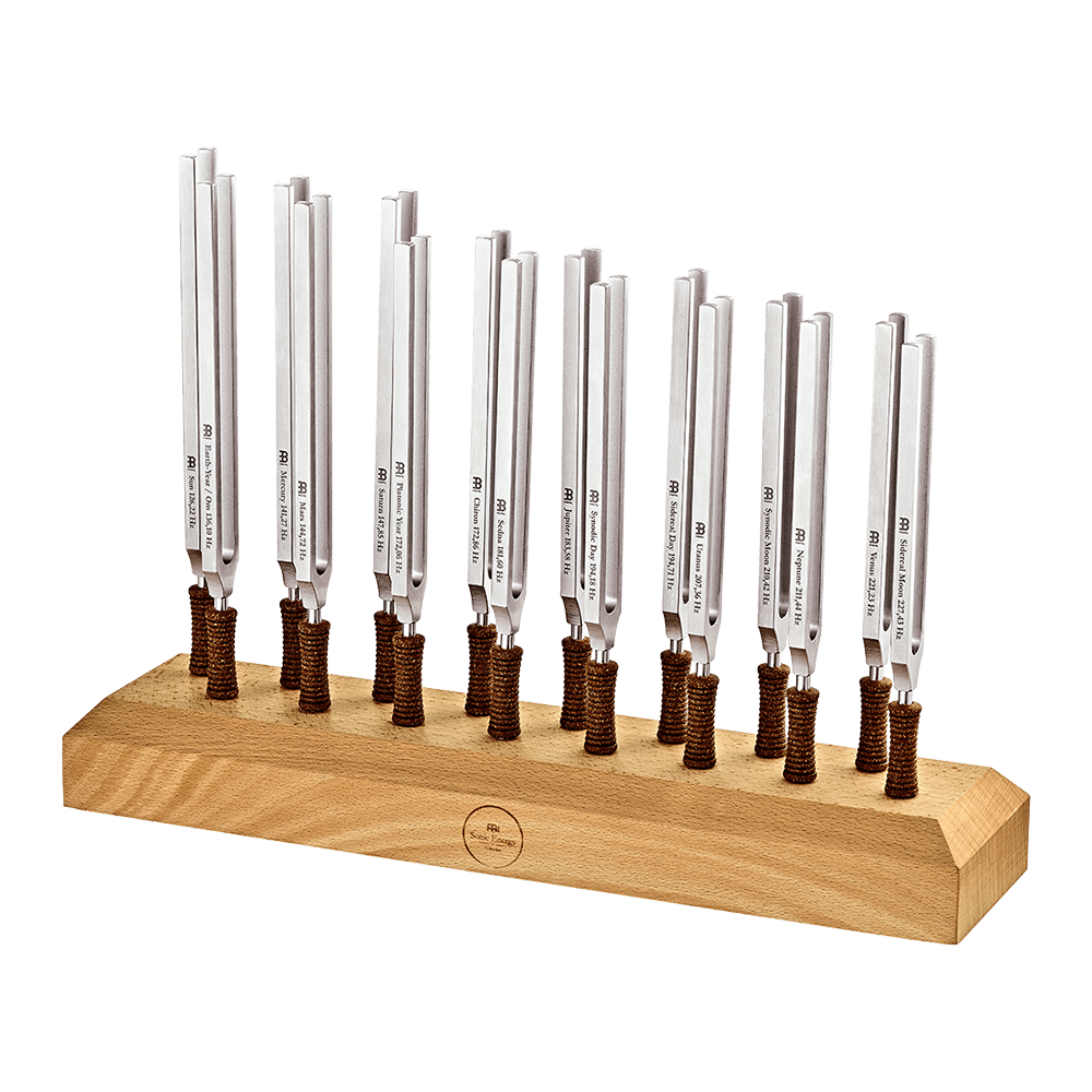 Sixteen weighted metal planetary tuning forks standing upright in a beech wood holder on a transparent background. — for Carpe Diem Dream