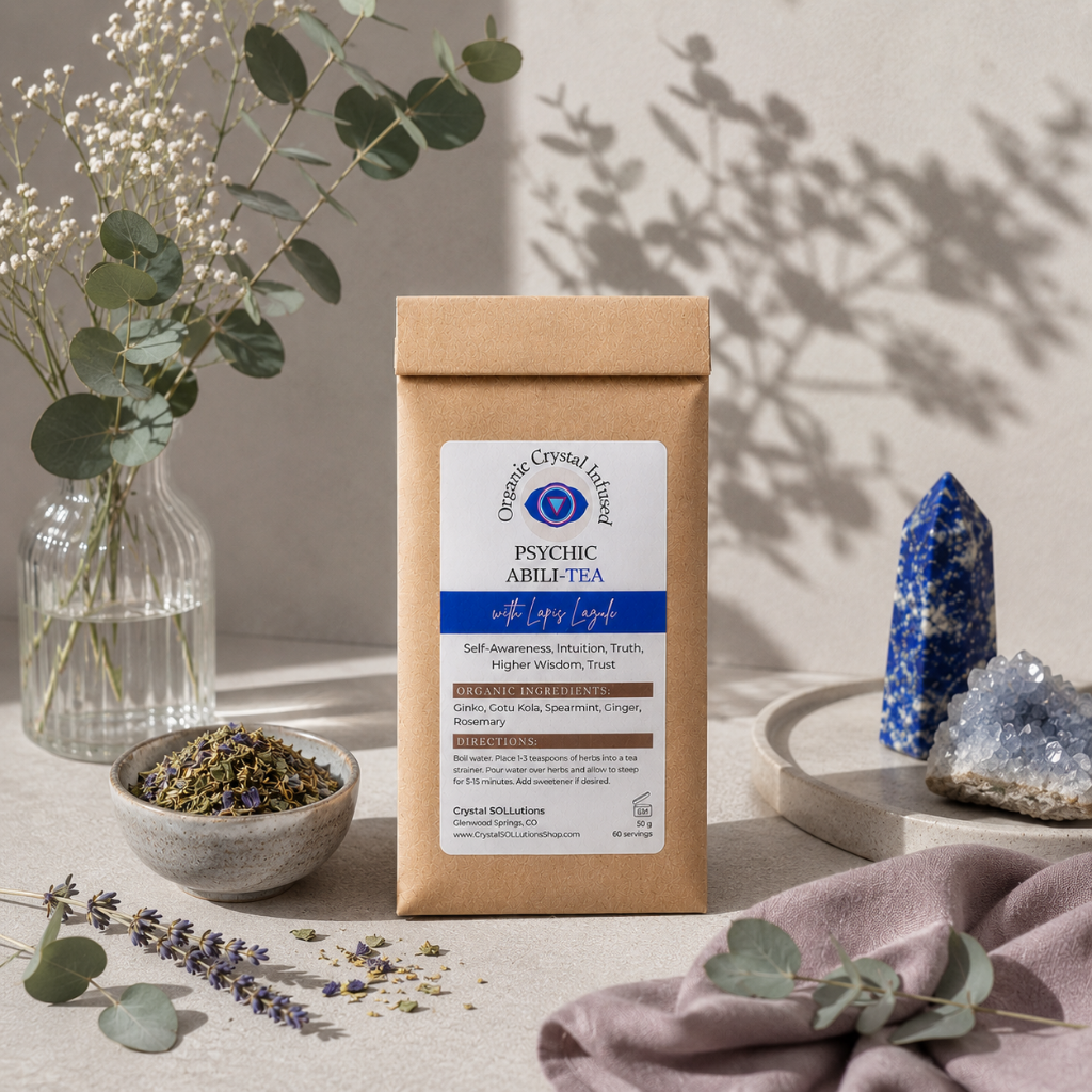 Psychic Abili-Tea – Organic Crystal Infused displayed with loose herbal tea blend, Lapis Lazuli crystal, eucalyptus accents, mauve textile, and a soft botanical shadow on a greige linen backdrop with cool-toned diffused daylight and refined studio styling. — for Carpe Diem Dream