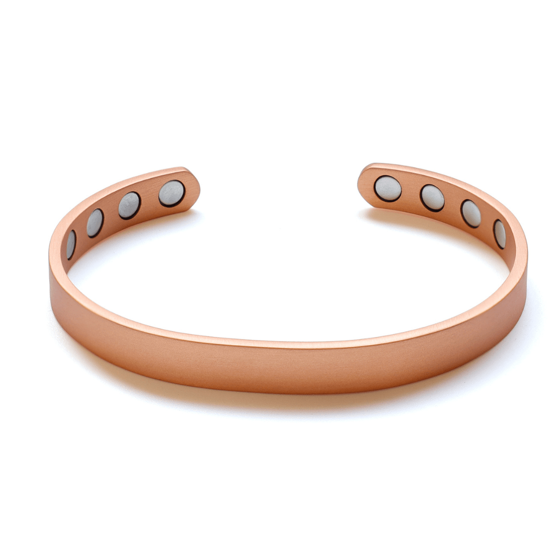 A pure copper magnetic cuff bracelet with an open adjustable design and visible magnet inserts displayed on a white background. — for Carpe Diem Dream