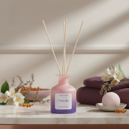A frosted glass reed diffuser in a pink to purple gradient styled with folded towels, flowers, and soft wellness elements on a marble surface in warm natural light. — for Carpe Diem Dream