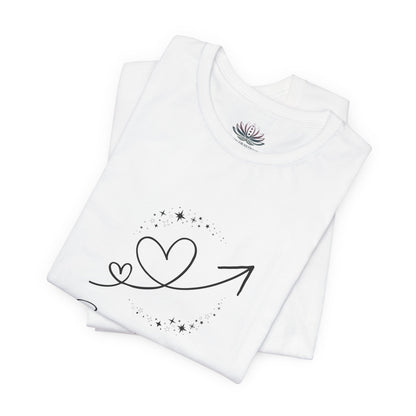 Sagittarius Rising I Explore zodiac T-shirt in white with black celestial heart and arrow artwork, shown folded in a supplier mockup. — for Carpe Diem Dream