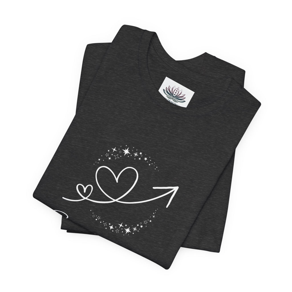 Sagittarius Rising I Explore zodiac T-shirt in Dark Grey Heather with white celestial heart and arrow artwork, shown folded in a supplier mockup. — for Carpe Diem Dream