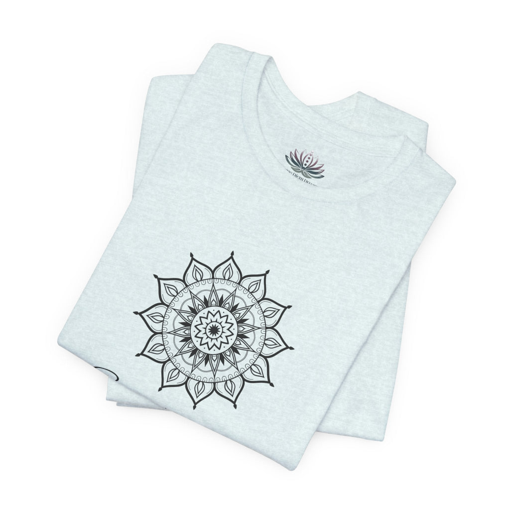 Sagittarius Sun I See zodiac T-shirt in heather ice blue with black sun-inspired mandala artwork, shown folded with Carpe Diem Dream neck label in a supplier mockup. — for Carpe Diem Dream