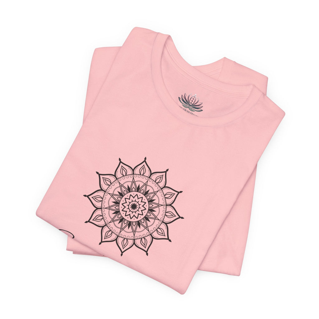 Sagittarius Sun I See zodiac T-shirt in pink with black sun-inspired mandala artwork, shown folded with Carpe Diem Dream neck label in a supplier mockup. — for Carpe Diem Dream