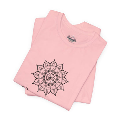 Sagittarius Sun I See zodiac T-shirt in pink with black sun-inspired mandala artwork, shown folded with Carpe Diem Dream neck label in a supplier mockup. — for Carpe Diem Dream