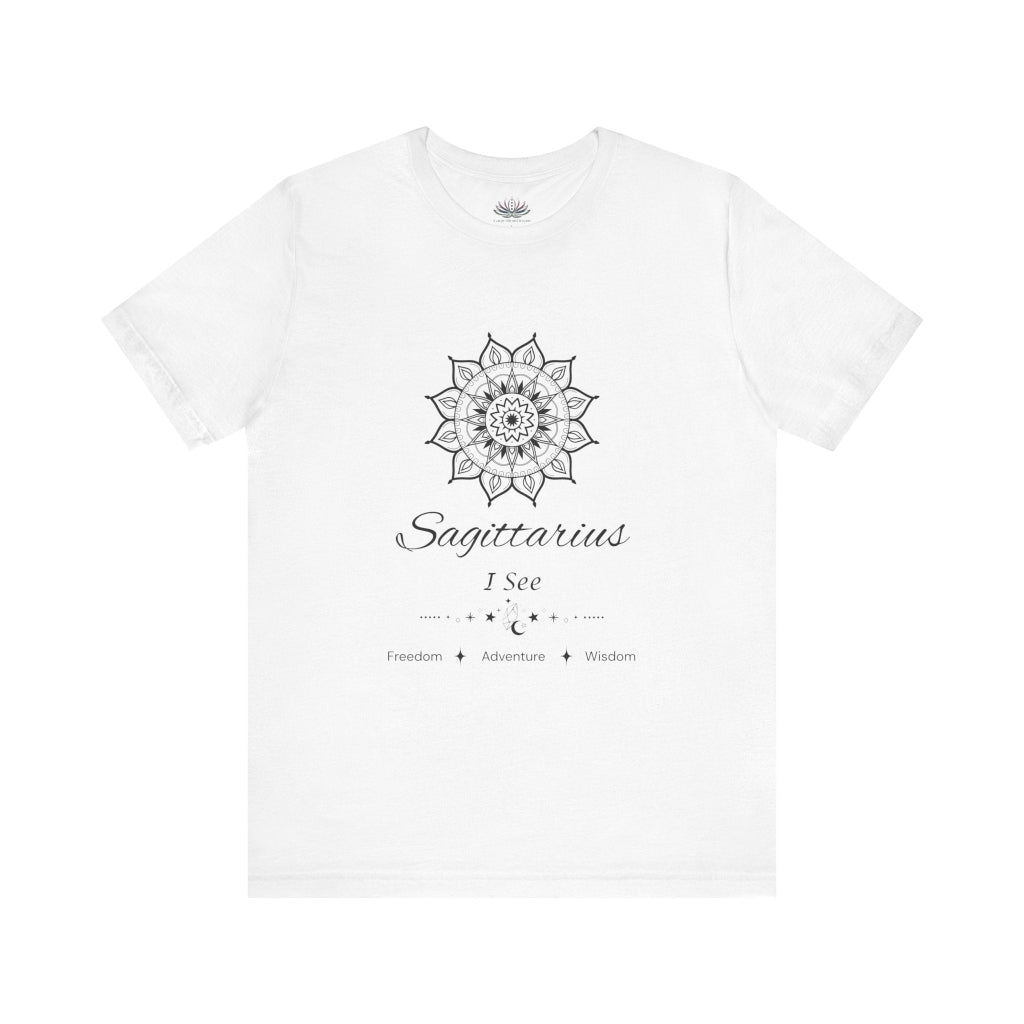 Sagittarius Sun I See zodiac T-shirt in white with black sun-inspired mandala artwork and Freedom, Adventure, Wisdom text, shown flat in a supplier mockup. — for Carpe Diem Dream