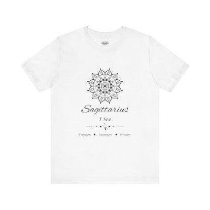 Sagittarius Sun I See zodiac T-shirt in white with black sun-inspired mandala artwork and Freedom, Adventure, Wisdom text, shown flat in a supplier mockup. — for Carpe Diem Dream