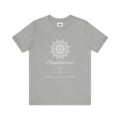 Sagittarius Sun I See zodiac T-shirt in athletic heather with white sun-inspired mandala artwork and Freedom, Adventure, Wisdom text, shown flat in a supplier mockup. — for Carpe Diem Dream