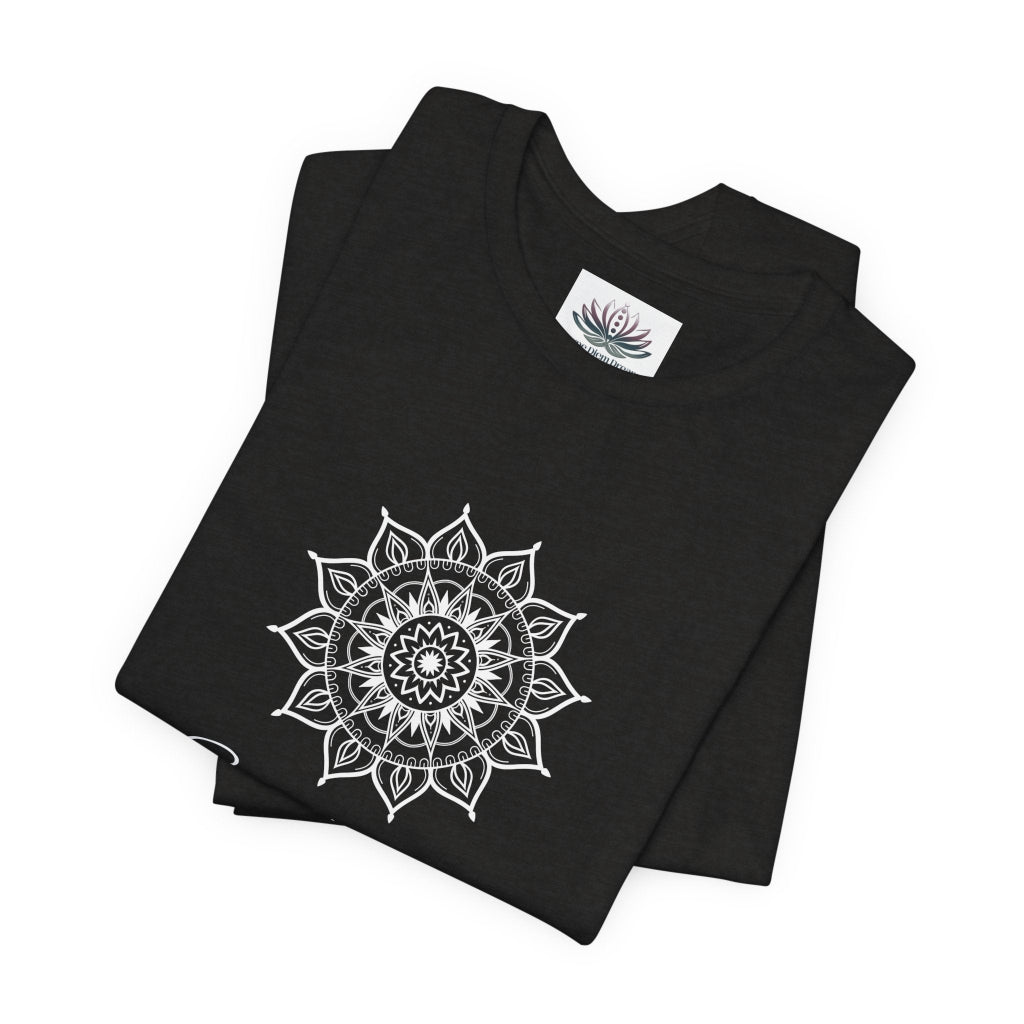 Sagittarius Sun I See zodiac T-shirt in black heather with white sun-inspired mandala artwork, shown folded with Carpe Diem Dream neck label in a supplier mockup. — for Carpe Diem Dream