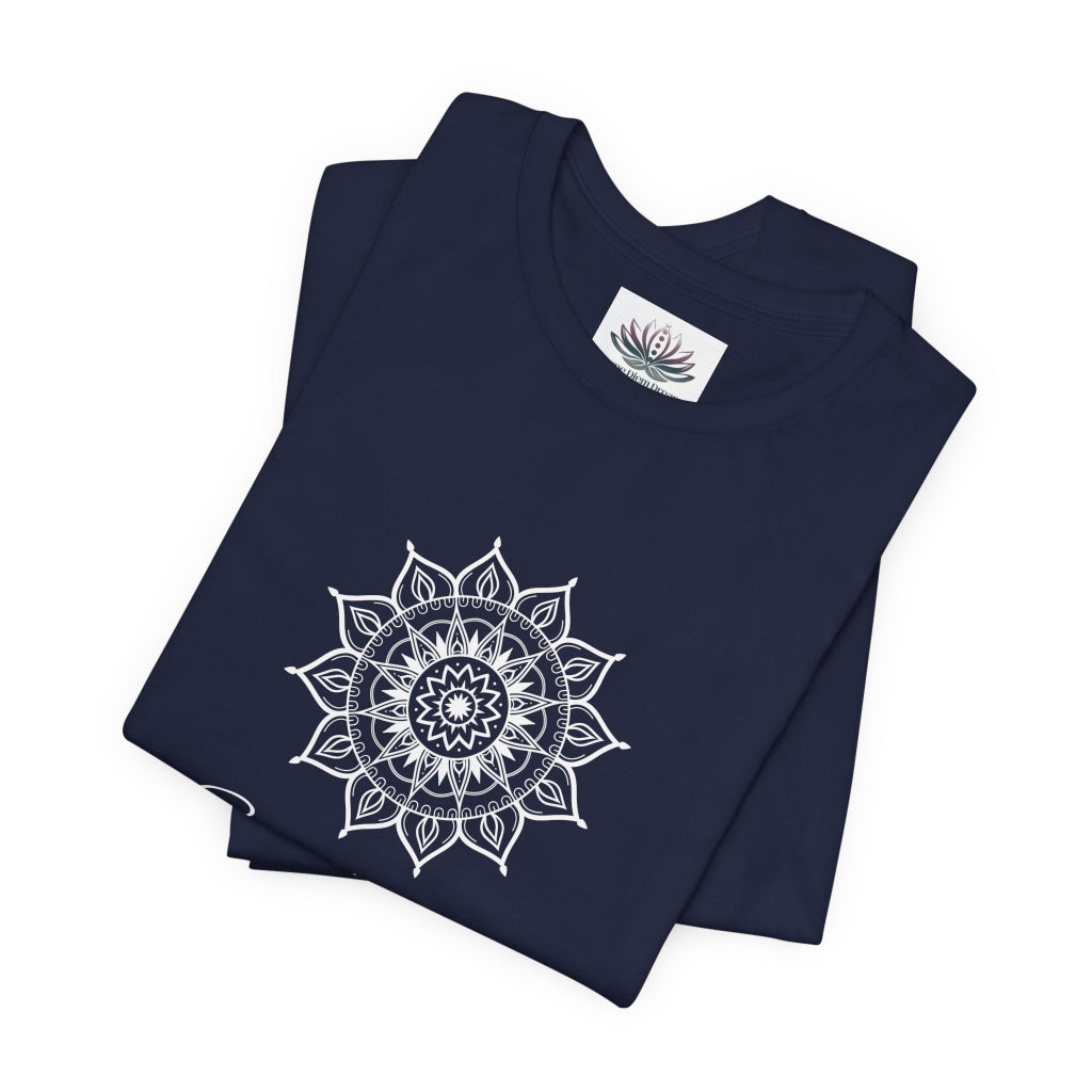 Sagittarius Sun I See zodiac T-shirt in navy with white sun-inspired mandala artwork, shown folded with Carpe Diem Dream neck label in a supplier mockup. — for Carpe Diem Dream