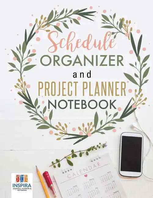 Schedule Organizer and Project Planner Notebook with floral wreath cover design displayed beside a calendar, pencil, and smartphone on a white background. — for Carpe Diem Dream