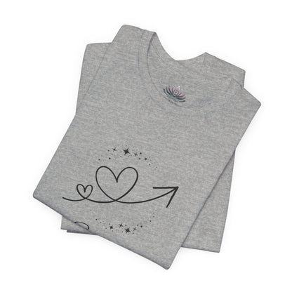 Scorpio Rising I Perceive zodiac T-shirt in Athletic Heather with black celestial heart and arrow artwork, shown folded in a supplier mockup. — for Carpe Diem Dream