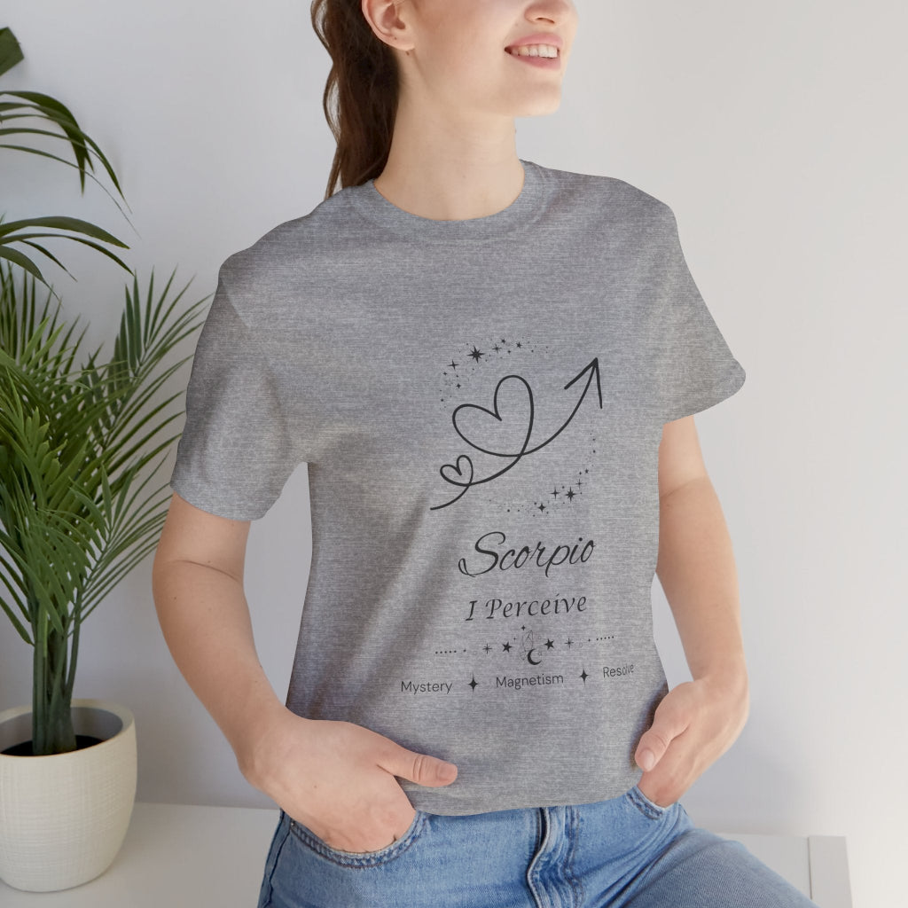 Model wearing an Athletic Heather Scorpio Rising I Perceive zodiac T-shirt with black celestial heart and arrow artwork. — for Carpe Diem Dream
