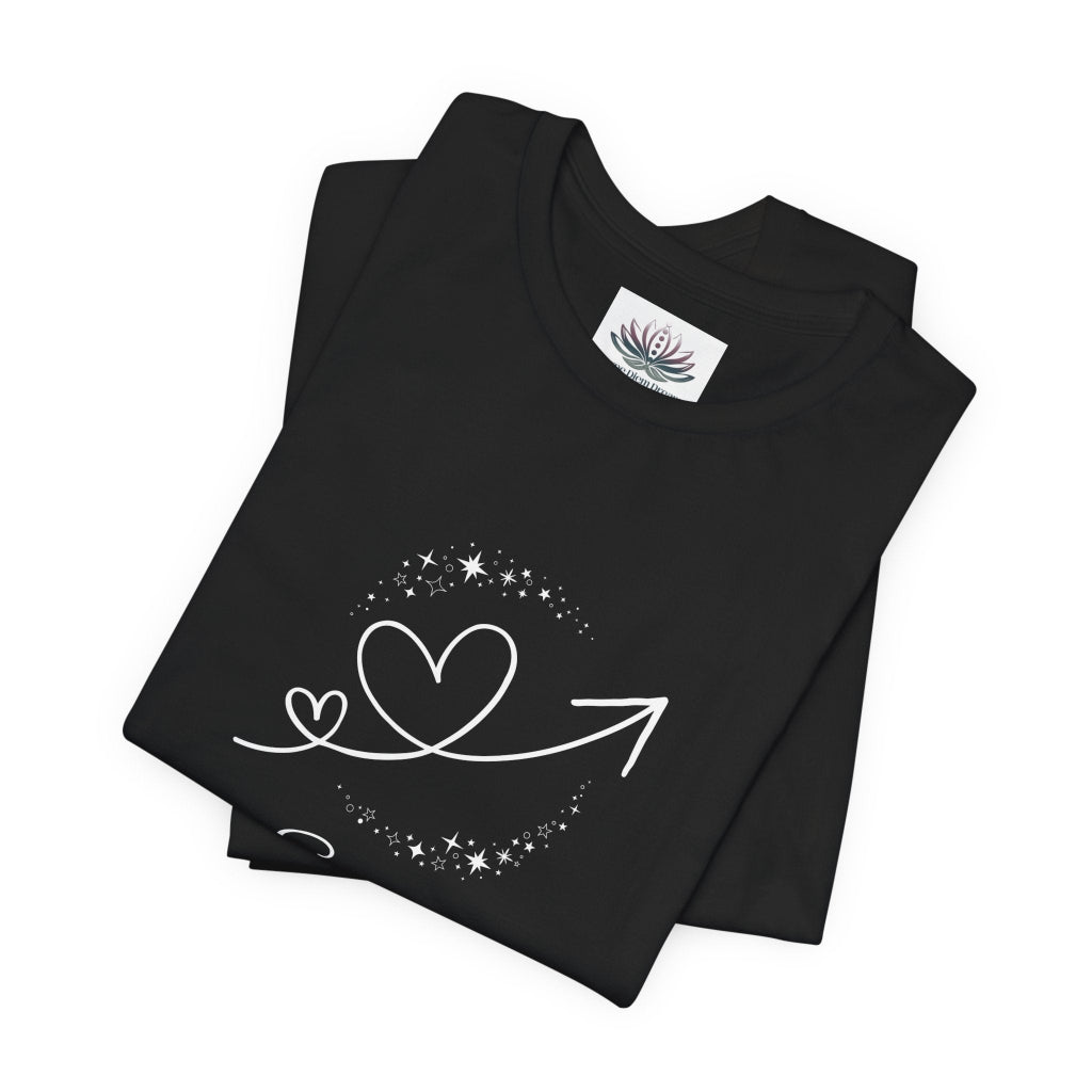 Scorpio Rising I Perceive zodiac T-shirt in black with white celestial heart and arrow artwork, shown folded in a supplier mockup. — for Carpe Diem Dream