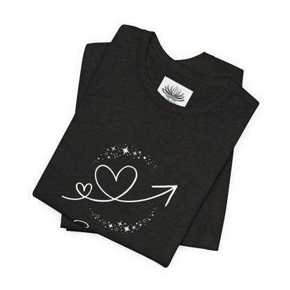 Scorpio Rising I Perceive zodiac T-shirt in Black Heather with white celestial heart and arrow artwork, shown folded in a supplier mockup. — for Carpe Diem Dream