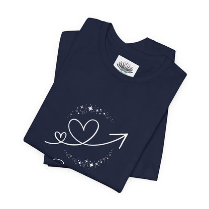 Scorpio Rising I Perceive zodiac T-shirt in navy with white celestial heart and arrow artwork, shown folded in a supplier mockup. — for Carpe Diem Dream