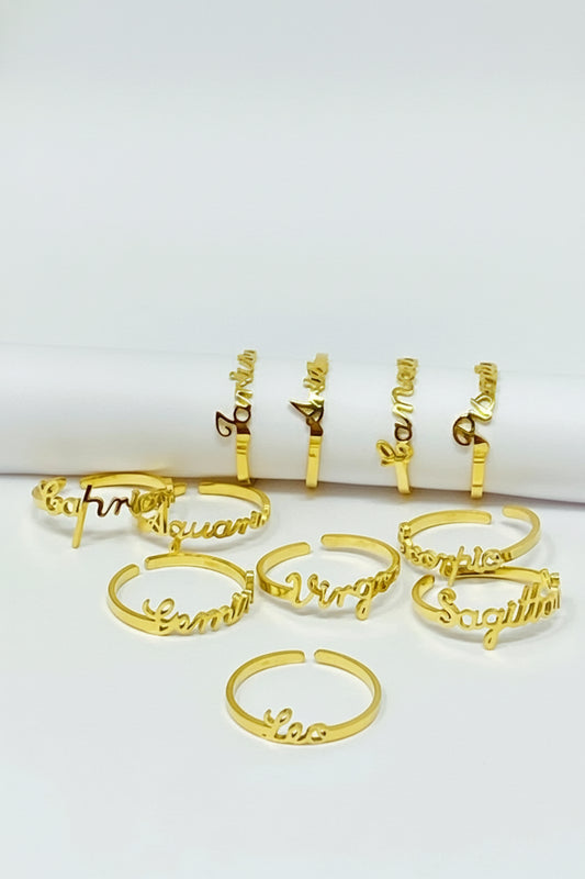 18K gold Scripted Zodiac Ring featuring delicate cursive lettering of zodiac names, displayed on white  background for Carpe Diem Dream