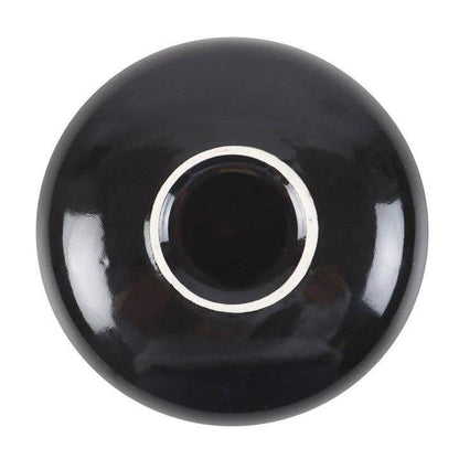 Bottom view of Snake & Flower Celestial Trinket Dish showing glossy black ceramic underside with smooth circular base and reflective finish, photographed against white background for Carpe Diem Dream’s mystical décor collection.