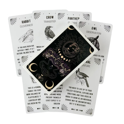 A Spirit Animal Oracle deck box placed over a fanned spread of animal-themed cards showing illustrated animals and descriptive text on a white background. — for Carpe Diem Dream
