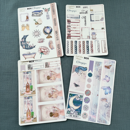 Four 4x6 stargazer planner sticker sheets featuring mystical illustrations, moon phases, crystals, and celestial icons displayed on a wooden surface. — for Carpe Diem Dream