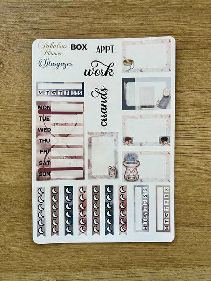 4x6 stargazer planner sticker sheet featuring weekly headers, moon phase icons, work labels, and celestial planning elements on a wooden background. — for Carpe Diem Dream
