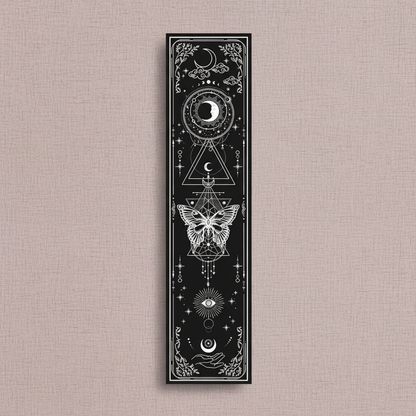 Vertical black sun and moon banner tapestry with celestial symbols and butterfly design displayed on a neutral linen background with soft natural lighting. — for Carpe Diem Dream