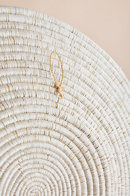 Back of Sunrise Wall Basket showing natural handwoven grass texture and attached hanger for wall mounting. — for Carpe Diem Dream