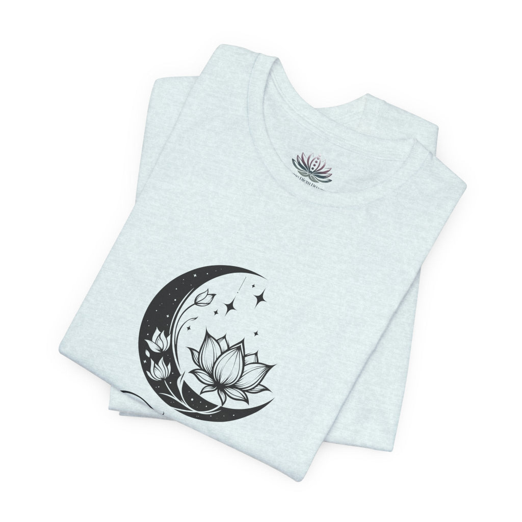 Taurus Moon I Cherish Stability zodiac T-shirt in Heather Ice Blue with black moon-inspired lotus, floral, and celestial artwork, shown folded in a supplier mockup. — for Carpe Diem Dream