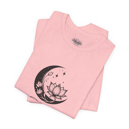 Taurus Moon I Cherish Stability zodiac T-shirt in pink with black moon-inspired lotus, floral, and celestial artwork, shown folded in a supplier mockup. — for Carpe Diem Dream