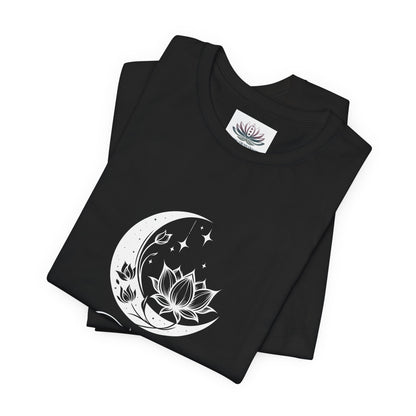 Taurus Moon I Cherish Stability zodiac T-shirt in black with white moon-inspired lotus, floral, and celestial artwork, shown folded in a supplier mockup. — for Carpe Diem Dream