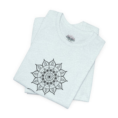 Taurus Sun I Have zodiac T-shirt in heather ice blue with black sun-inspired mandala artwork, shown folded with Carpe Diem Dream neck label in a supplier mockup. — for Carpe Diem Dream