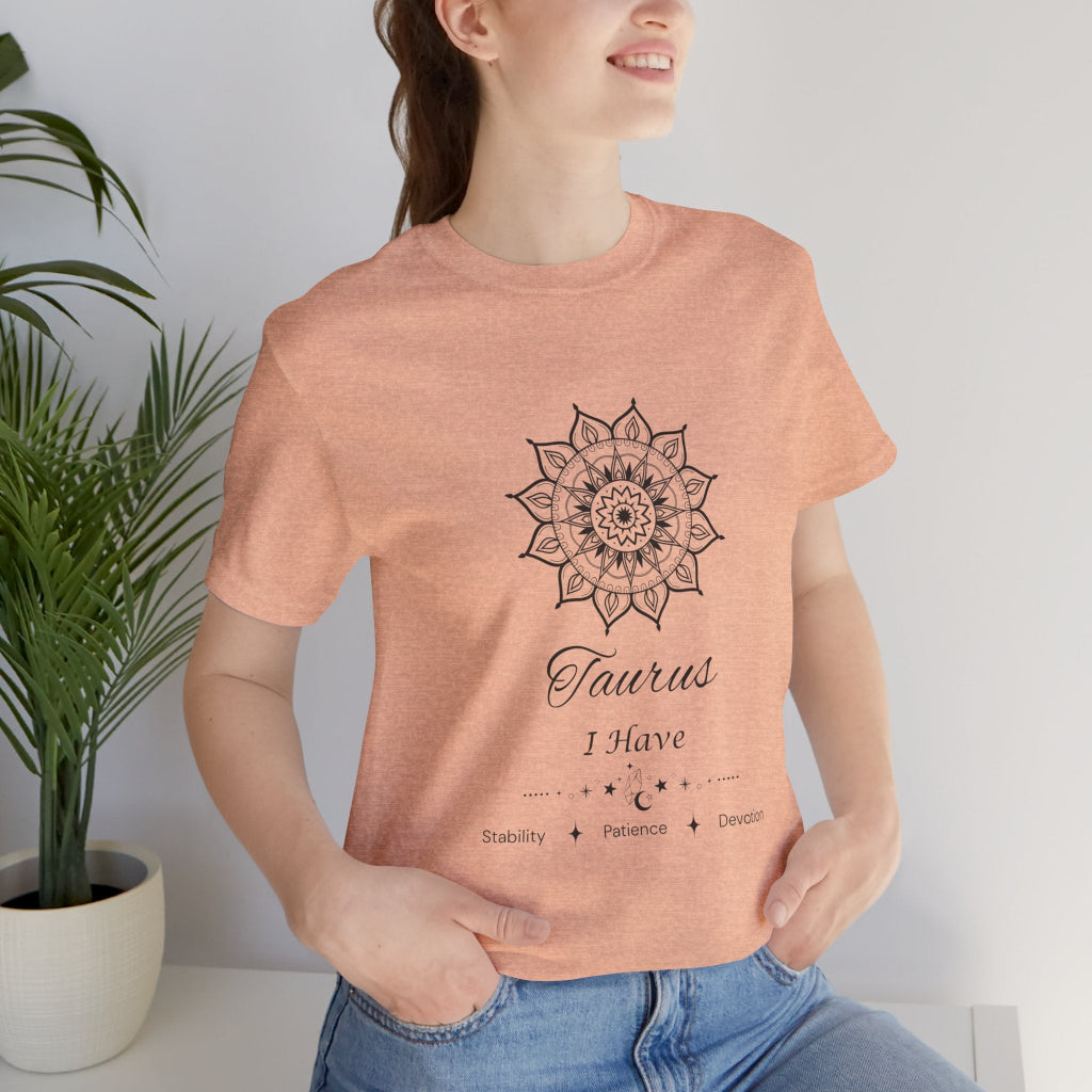 Taurus Sun I Have zodiac T-shirt in heather peach with black sun-inspired mandala artwork, shown worn by a model in a supplier mockup. — for Carpe Diem Dream
