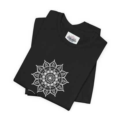 Taurus Sun I Have zodiac T-shirt in black with white sun-inspired mandala artwork, shown folded with Carpe Diem Dream neck label in a supplier mockup. — for Carpe Diem Dream